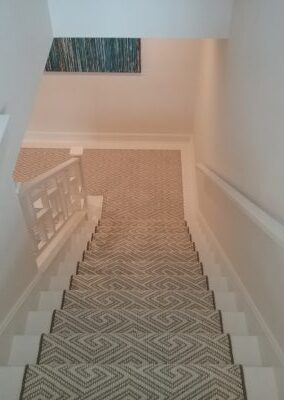 Geometric patterned carpeted staircase